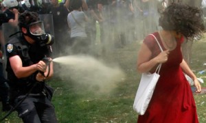 Turkish riot policeman uses tear gas against
