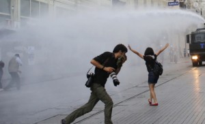 Riot police use water cannon to disperse demonstrators during a protest in central Istanbul