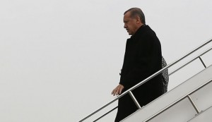 Turkey's Prime Minister Erdogan steps off from his plane as he arrives in Elazig for an election rally of his ruling AK Party