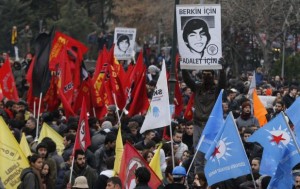 A demonstrator holds up a poster of Berkin Elvan during a protest in Ankara